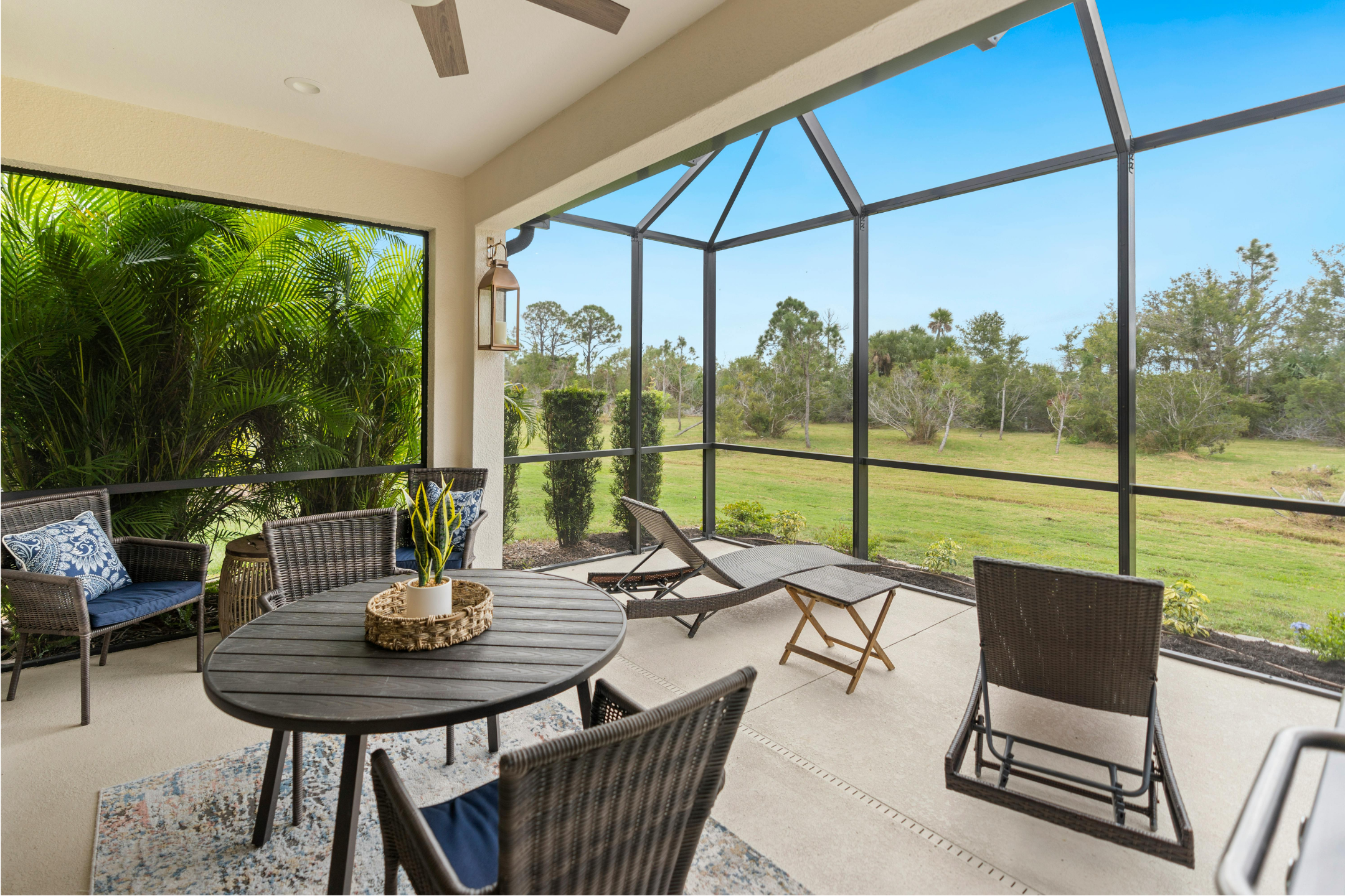 Florida sunroom with screened walls and outdoor furniture