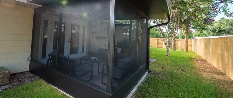 Completed screen room seen from the backyard