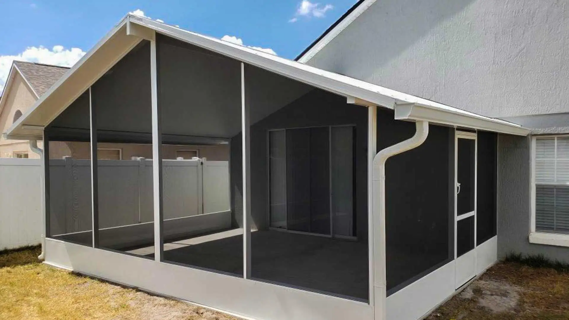 Screened sunroom enclosure on a Florida home