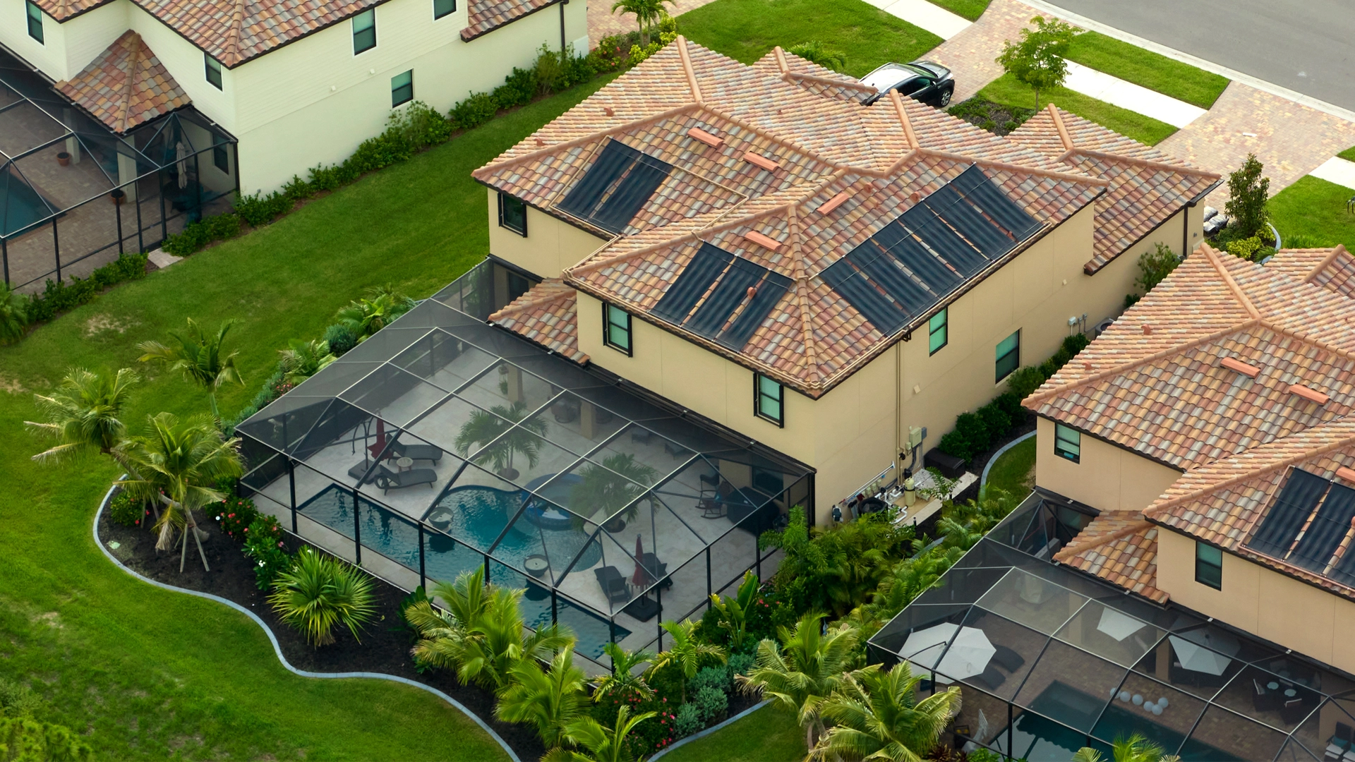 Aluminum pool cage over a backyard swimming pool at a Lakeland, FL home